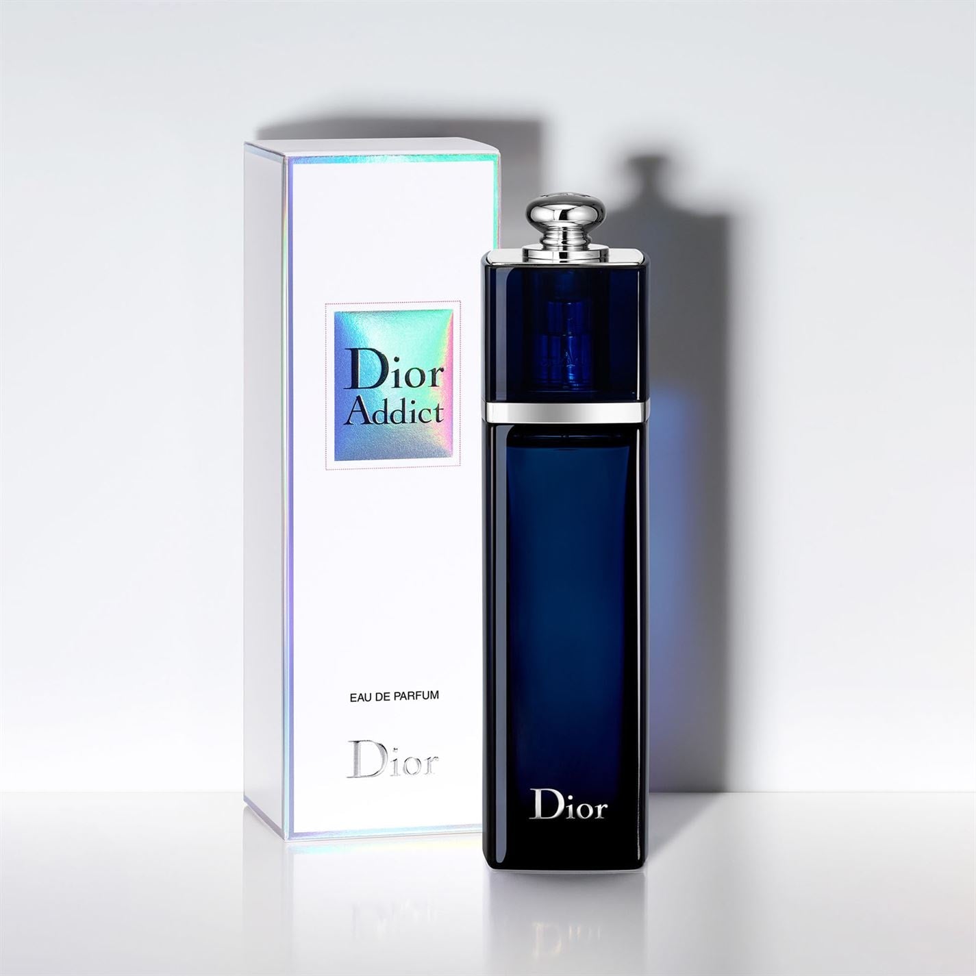 Dior Addict Eau de Parfum 100ml bottle, a luxurious and sensual fragrance with notes of mandarin, jasmine, and vanilla, housed in a sleek golden bottle, perfect for evening glamour and special occasions.