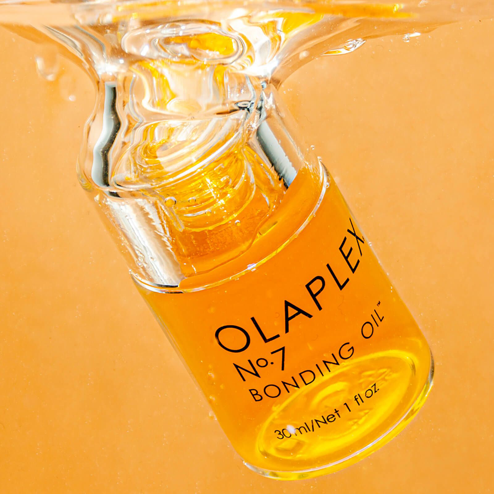 "Olaplex No  7 Bonding Oil – a highly concentrated, weightless hair oil that enhances shine, strengthens, reduces frizz, and provides heat protection up to 450°F (232°C)."