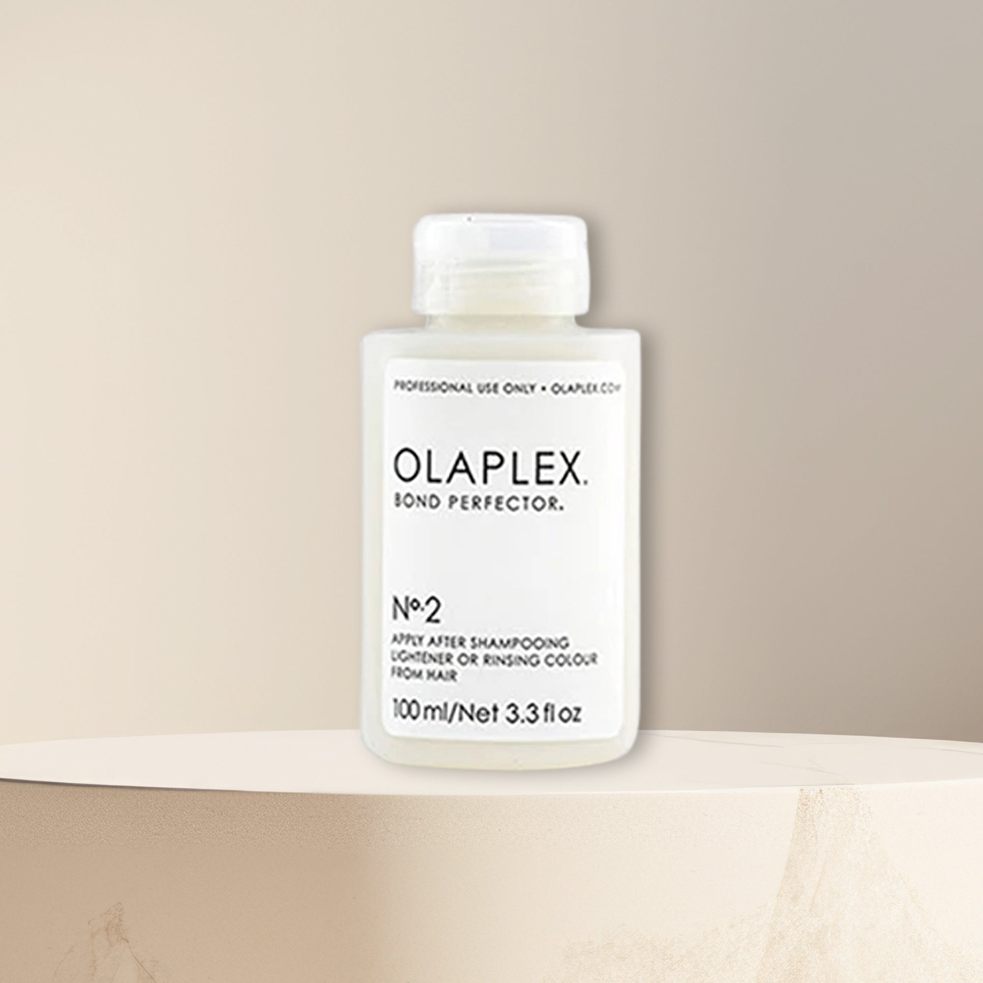 "Olaplex No. 2 Bond Perfector 100ml – a professional hair treatment that repairs and strengthens damaged hair, reducing breakage and improving overall hair health, suitable for all hair types."







